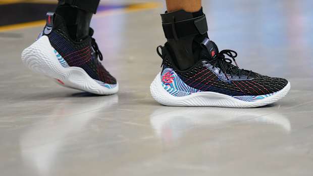 Black, blue, and white Curry shoes.